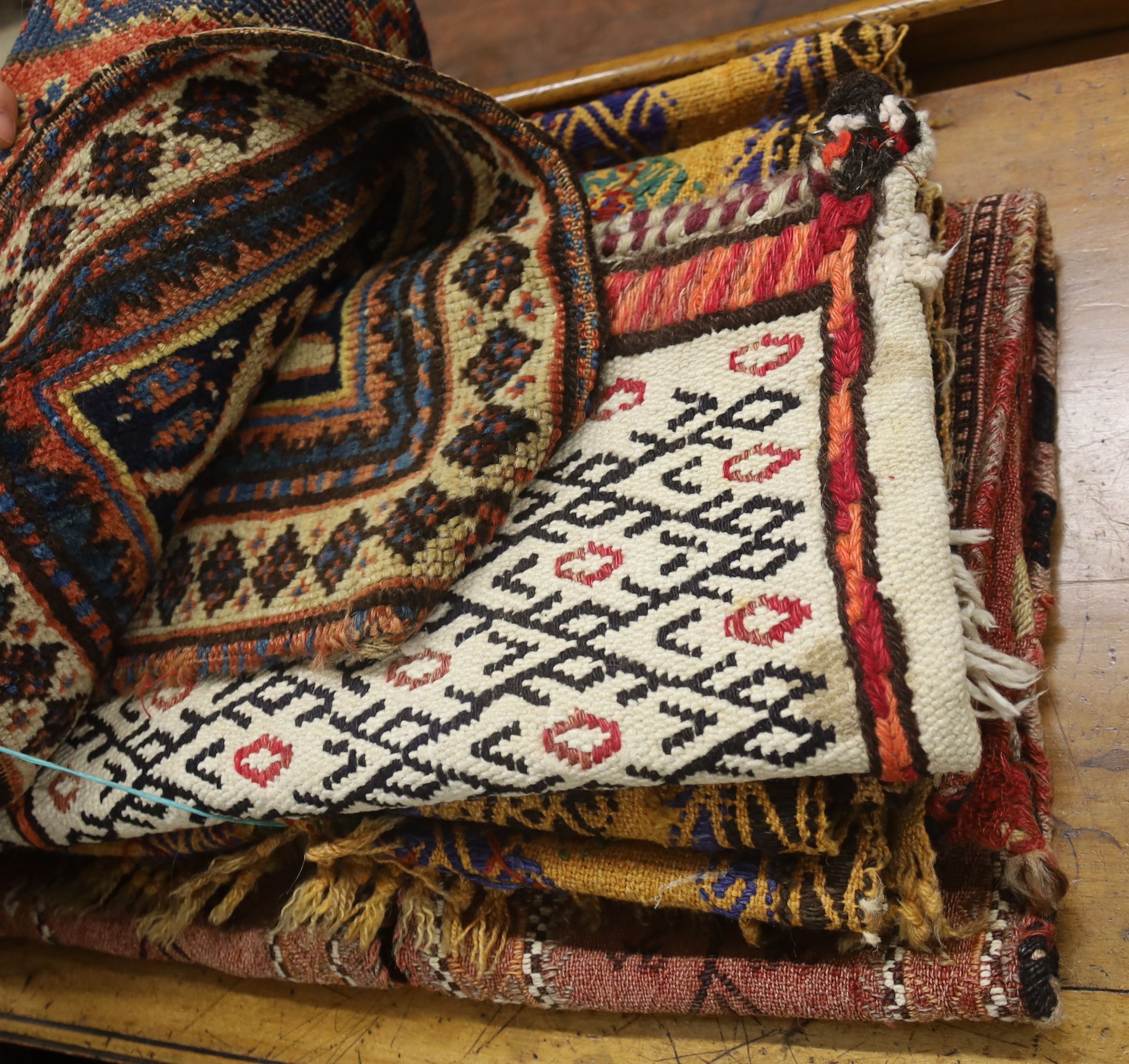 Seven Middle Eastern rugs/saddle bags